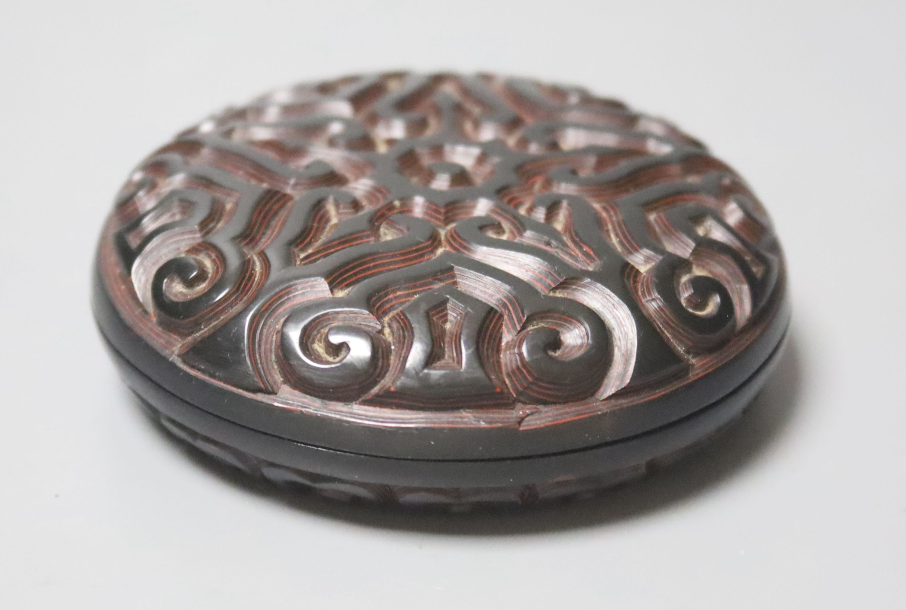 A Chinese 'tixi' lacquer circular box and cover, 8cm diameter